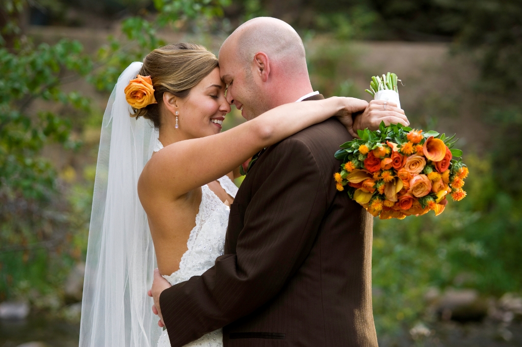 Bride and Groom Embrace on Wedding Day.  ProPhoto RGB.